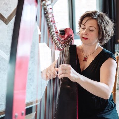 Keri Zwicker playing a harp