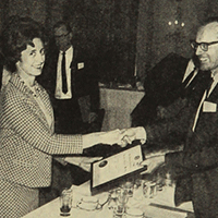 Virginia McKay receiving her certificate of membership (1967)