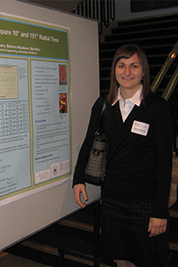 Nancy Manchak, P_.Eng., stands in front of her poster presentation for WISEST.