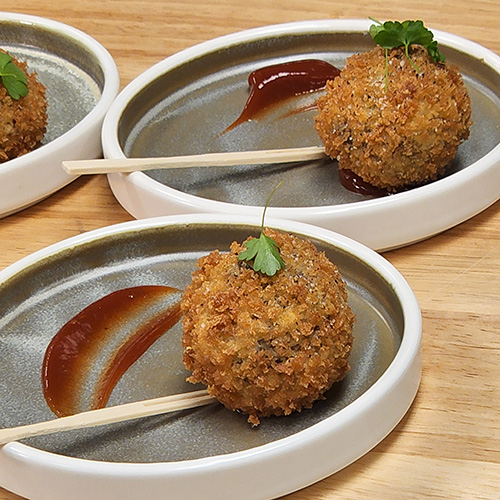 croquettes a plate of round croquettes