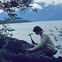 Alice Payne, P.Geol. hammering away with her rock hammer on a field trip to Jasper in the early 1960s.