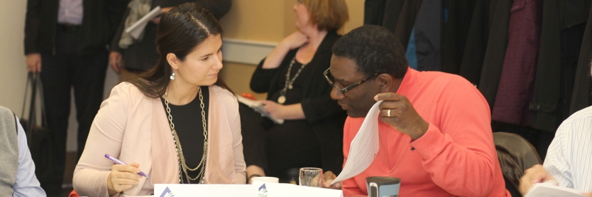 Legislative Review - Champions Collaborative A woman and a man in professional attire review information together